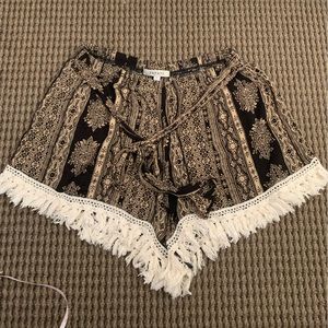 Papaya size M flowy patterned shorts with front tie and fringe